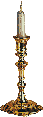 golden candle holder with a lit white candle